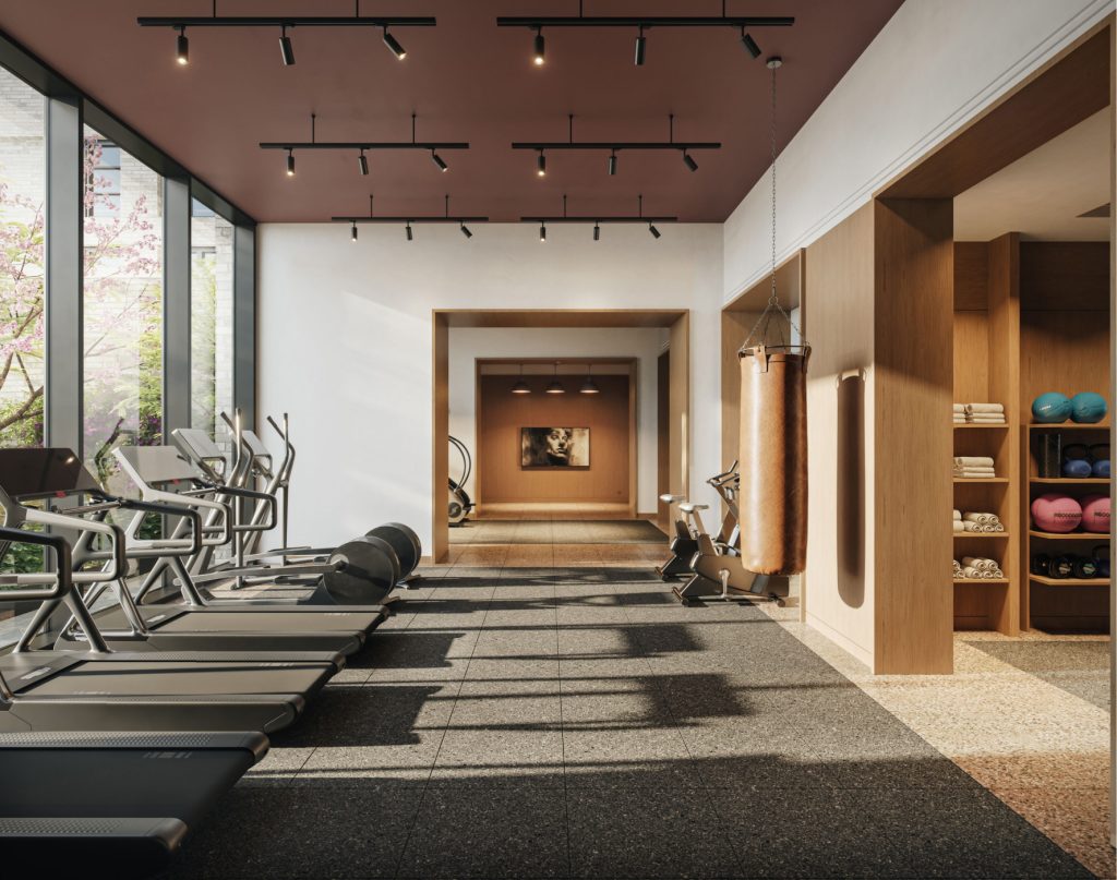 Ground floor fitness center at 499 President Street apartments with pilates studio, golf simulator and treadmills.