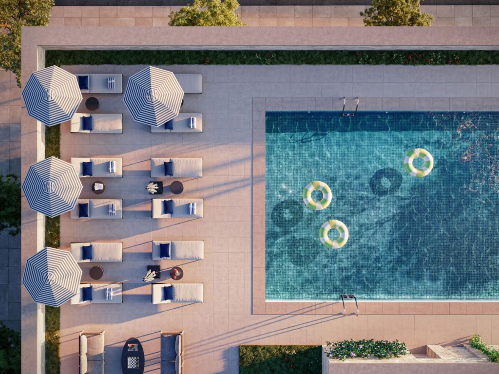 Aerial view of the 10th floor pool with lounge chairs & grilling stations at 499 President St, new luxury rentals in Gowanus.