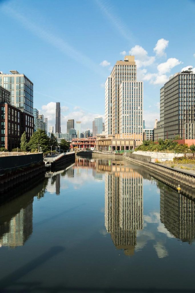 View of the Gowanus Canal with the Brooklyn skyline in the background, home to the new apartments at 499 President.